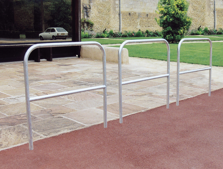 Steel hoop barrier with crossbar for greater strength. In 3 lengths and 1m hight. Concreted in as standard. Trolley bay essential image